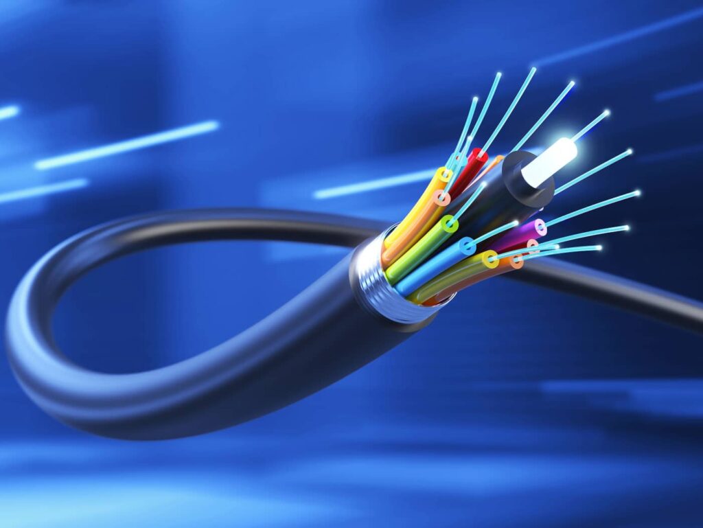 Close-up of a fiber optic cable with glowing strands and colorful internal wiring – high-speed data transmission solution in Oxnard, CA